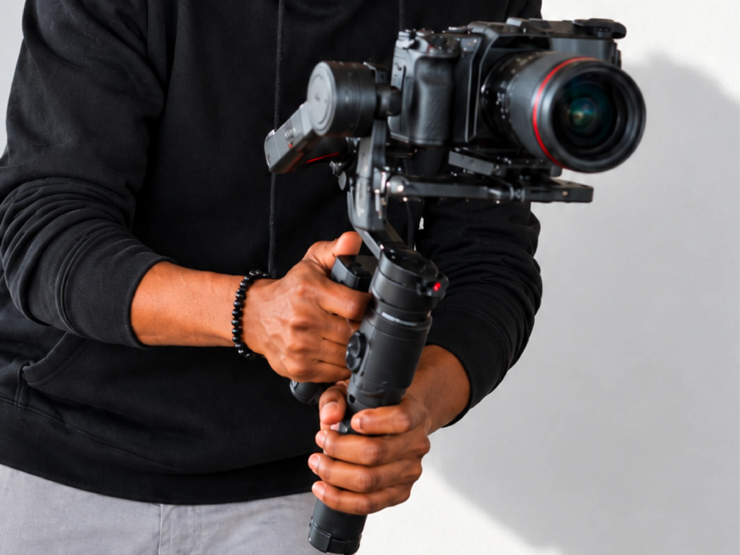 Camera operator with a handheld stabilizer illustrating video production